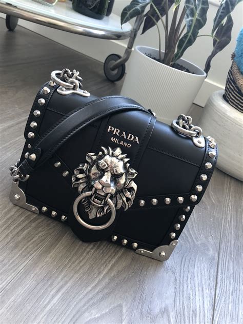 prada cahier lion head black and silver|Prada handbags.